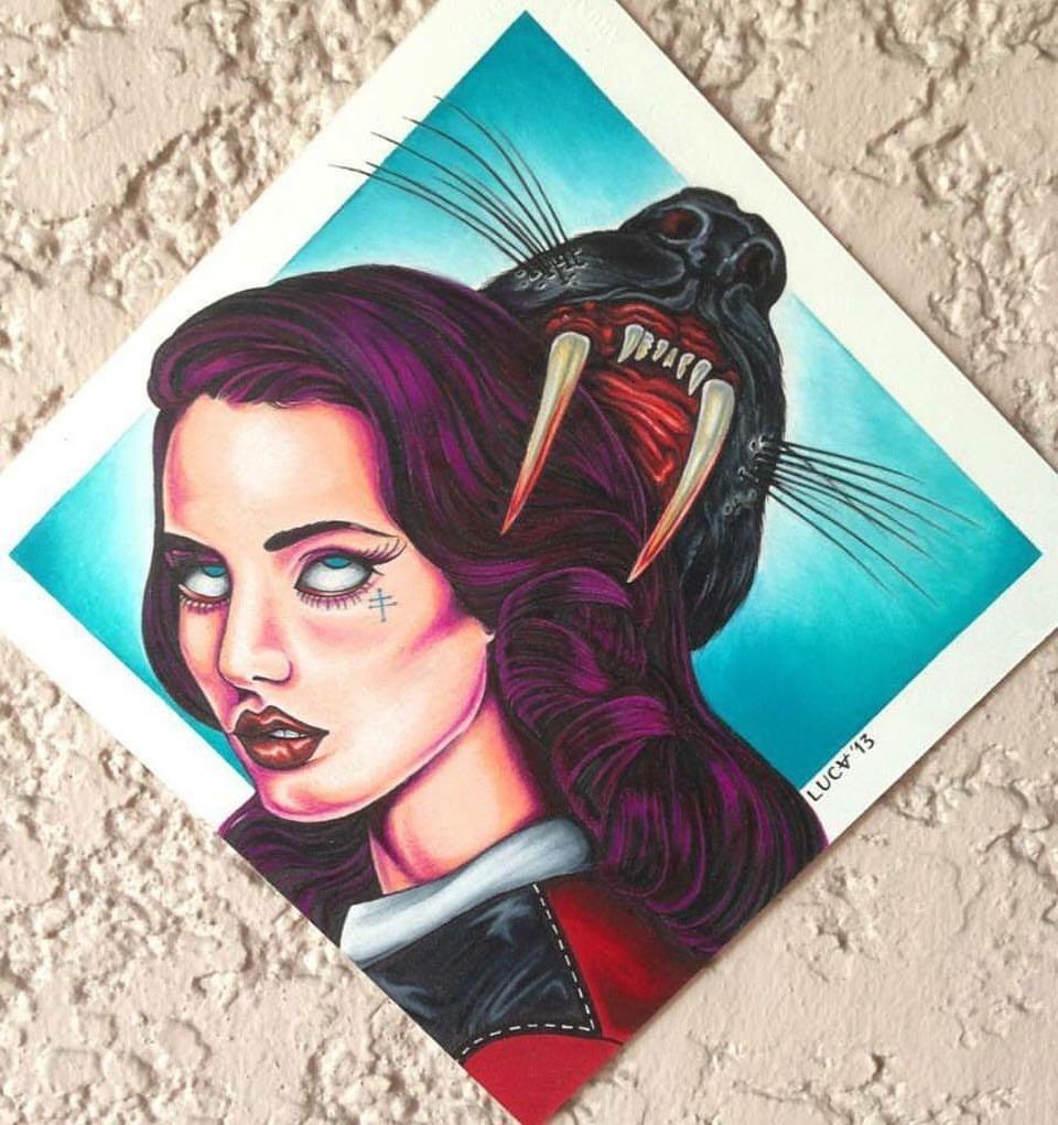 Painted portrait beside a dark animal skull on a turquoise background.